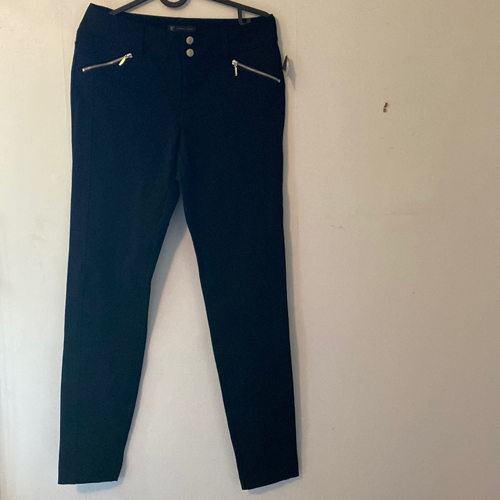 New black trousers, front pocket zip detail. Slit back pockets, western dart.